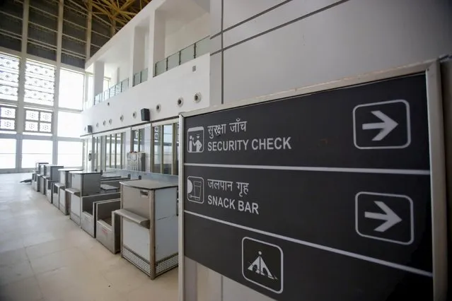 Signage is displayed inside the Jaisalmer Airport in desert state of Rajasthan, India, August 13, 2015. (Photo by Anindito Mukherjee/Reuters)