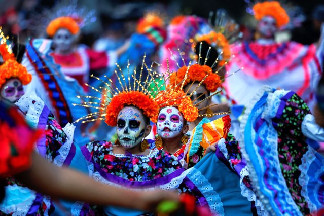 Girls dressed as Catrinas take part in the annual parade of Catrinas on the Day of the Dead, in Saltillo, Mexico on November 2, 2024. (Photo by Daniel Becerril/Reuters)