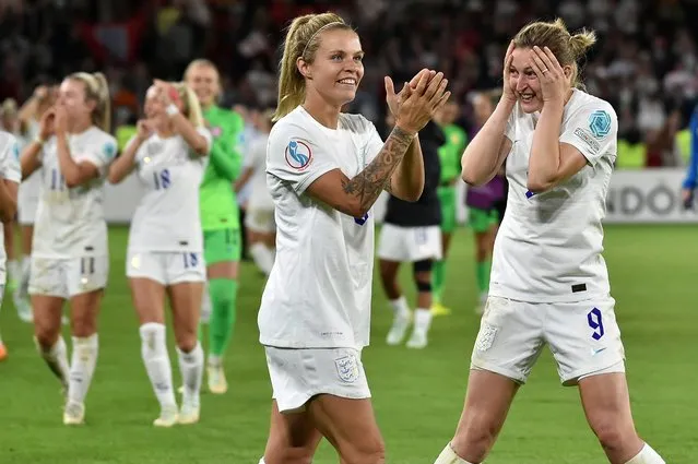 England's Leah Williamson, centre, and Ellen White celebrate as they won the Women Euro 2022 semi final soccer match between England and Sweden at the Bramall Lane Stadium in Sheffield, England, Tuesday, July 26, 2022. (Photo by Rui Vieira/AP Photo)