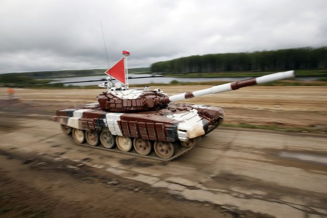 A tank drives on the course of the Tank Biathlon world championship in Alabino outside Moscow August 16, 2014. (Photo by Maxim Zmeyev/Reuters)