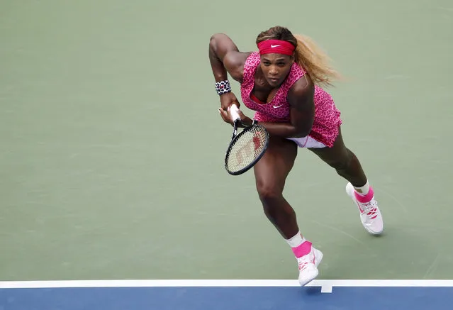 Serena Williams, of the United States, chases down shot against Kaia Kanepi, of Estonia, during the fourth round of the 2014 U.S. Open tennis tournament, Monday, September 1, 2014, in New York. (Photo by Seth Wenig/AP Photo)