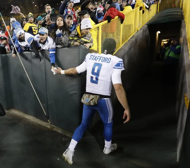 Detroit Lions' Matthew Stafford shakes hands with fans after an NFL football game against the Green Bay Packers Monday, November 6, 2017, in Green Bay, Wis. The Lions won 30-17. (Photo by Mike Roemer/AP Photo)
