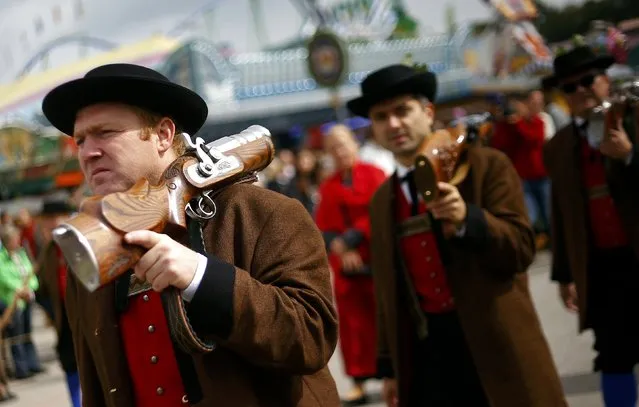 People dressed in traditional Bavarian clothes take part in the Oktoberfest parade in Munich, Germany, September 20, 2015. (Photo by Michael Dalder/Reuters)