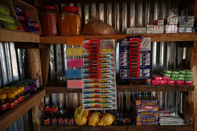 Healthcare products are displayed for sale in a shop in Palong Khali refugee camp near Cox's Bazar, Bangladesh, October 24, 2017. Bangladeshi trader Mohammed Absar, 20, has been trading for two months in the camp. “I sell cakes, biscuits, and many other things”, he said. “I buy from the wholesaler who comes into the camp so I can buy it cheaper”. The price in Palong Khali refugee camp is 15 taka per toothbrush. The price in Palong Khali Bazar is 7.5 taka per toothbrush. (Photo by Hannah McKay/Reuters)