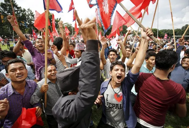 People cheer during a celebration a day after the first democratic constitution was announced in Kathmandu, Nepal September 21, 2015. (Photo by Navesh Chitrakar/Reuters)