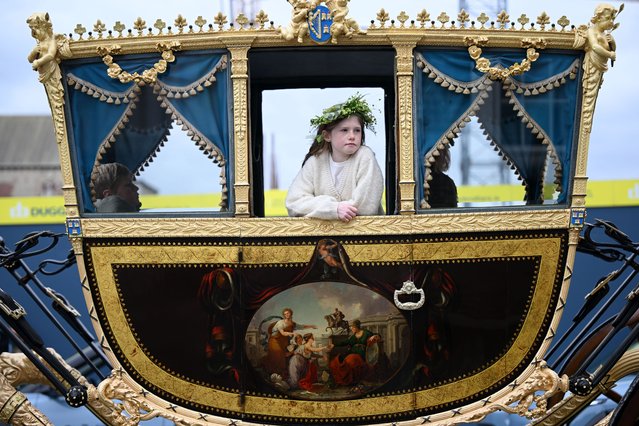 A young participant sits in a carriage at Dublin's St Patrick's Day Parade on March 17, 2025 in Dublin, Ireland. St. Patrick's Day is marked annually on March 17, the traditional death date of Ireland's patron saint, and has become a celebration of Irish culture and heritage worldwide. (Photo by Charles McQuillan/Getty Images)