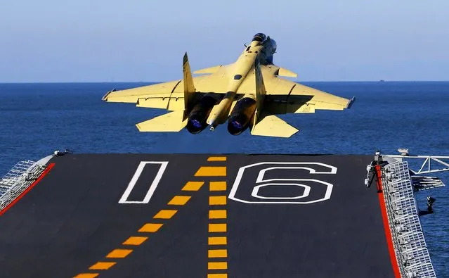 In this undated photo released by China's Xinhua News Agency, made available on Sunday a carrier-borne J-15 fighter jet takes off from China's first aircraft carrier, the Liaoning. China has successfully landed a fighter jet on its first aircraft carrier, which entered service two months ago, the country's official news agency confirmed Sunday. (Photo by Zha Chunming/Xinhua)