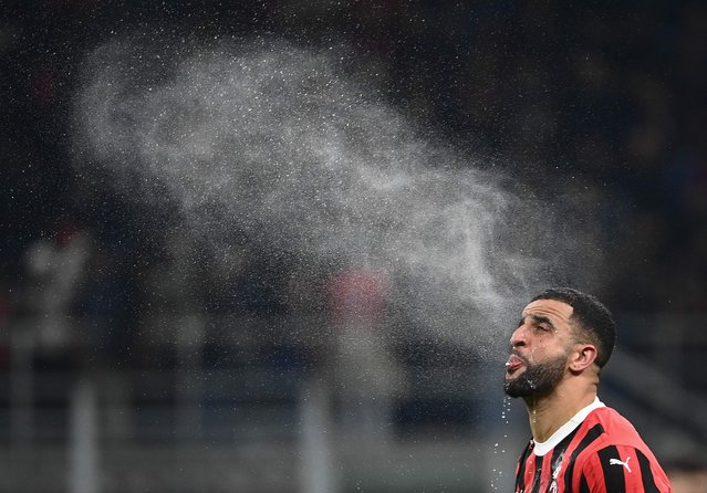 AC Milan's Italian midfielder #32 Tommaso Pobega Alejandro spits water during the Italian Cup semi-final first leg football match between AC Milan and Inter Milan at San Siro stadium in Milan, on April 2, 2025. (Photo by Isabella Bonotto/AFP Photo)