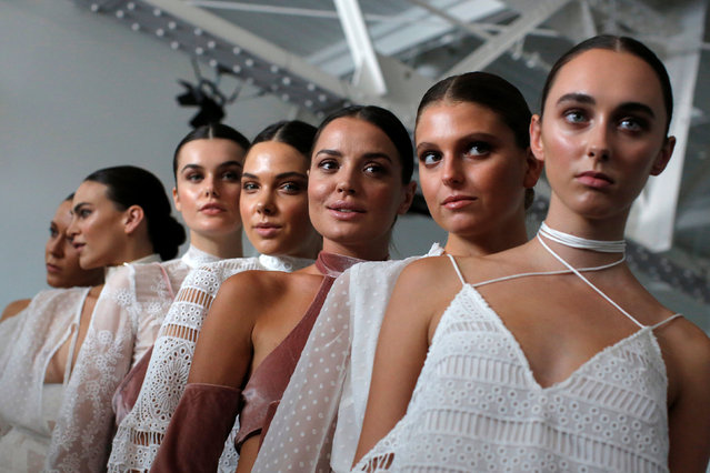 Models pose backstage before the Spring/Summer 2017 Fashion Palette show at New York Fashion Week in Manhattan, New York, U.S., September 8, 2016. (Photo by Andrew Kelly/Reuters)
