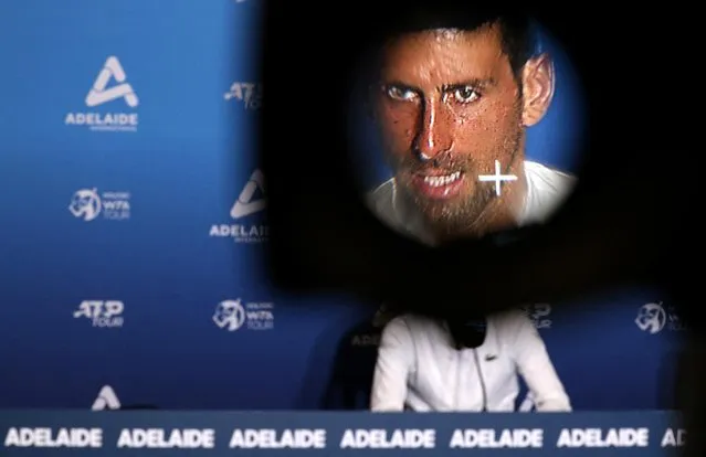 Serbia's Novak Djokovic is seen through a viewfinder of a television camera during a press conference after winning his first round Adelaide International match against France's Constant Lestienne, Memorial Drive Tennis Club, Adelaide, Australia on January 3, 2023. (Photo by Loren Elliott/Reuters)