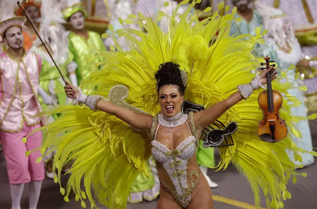 A dancer from the Tom Maior samba school performs during a carnival parade in Sao Paulo, Brazil, Saturday, February 10, 2018. (Photo by Andre Penner/AP Photo)