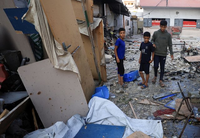 Palestinians inspect the damage at a school sheltering displaced people, following an overnight Israeli airstrike, in Gaza City, on July 3, 2025. (Photo by Dawoud Abu Alkas/Reuters)