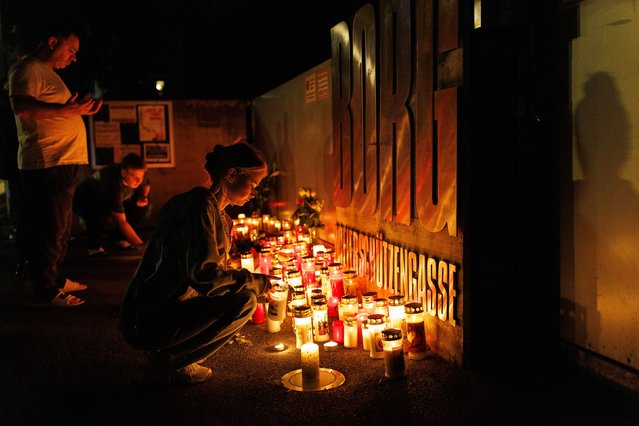 People light candles at a high school in Graz, Austria, following a shooting there on Tuesday, June 10, 2025. Ten people, mostly teenagers, were killed in what was one of the worst rampages in the country’s history. (Photo by Matej Povse/Getty Images)