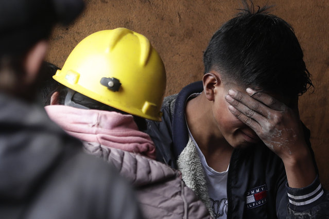 A man grieves outside a coal mine affected by an explosion that according to authorities killed at least 11 people in Sutatausa, in the Cundinamarca province of Colombia, Wednesday, March 15, 2023. (Photo by Ivan Valencia/AP Photo)