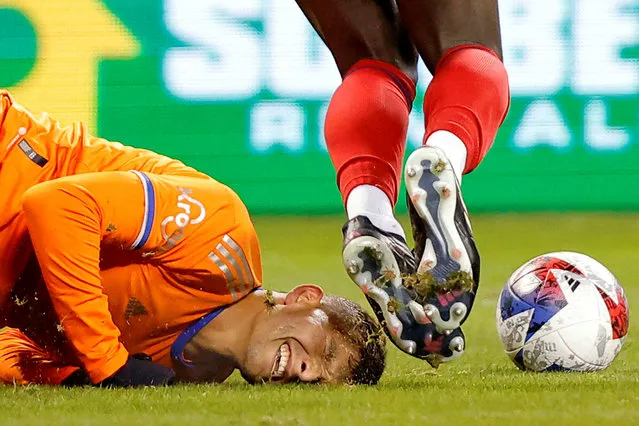 FC Cincinnati forward Brandon Vazquez (19) reacts after falling against Chicago Fire midfielder Carlos Teran (6) during the first half at Soldier Field in Chicago, Illinois on March 18, 2023. (Photo by Jon Durr/USA TODAY Sports)