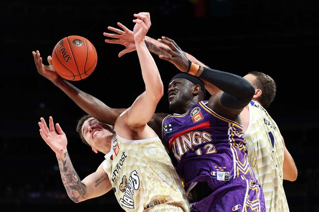 Kouat Noi of the Kings, center, competes for the ball during an NBL game against the Taipans in Sydney, Australia, on Sunday, September 28, 2025. (Photo by Mark Metcalfe/Getty Images)