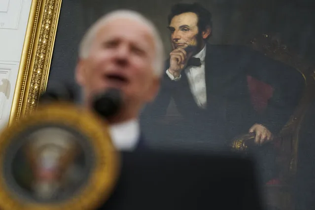 A portrait of former President Abraham Lincoln President hangs in the State Dining Room of the White House as Joe Biden delivers remarks on the economy Friday, January 22, 2021, in Washington. (Photo by Evan Vucci/AP Photo)