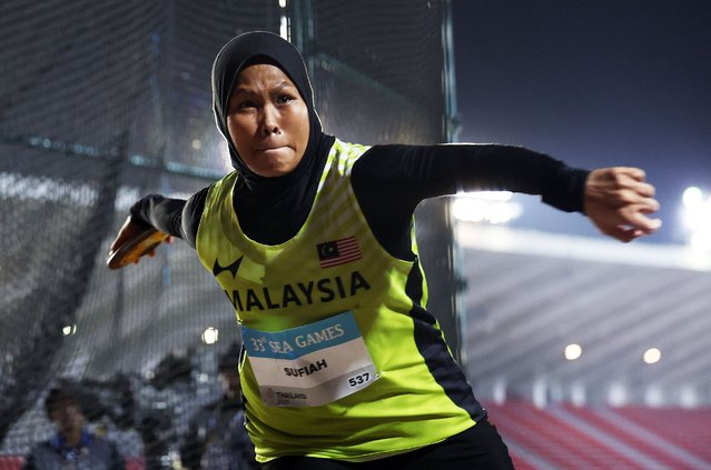 Nur Atiqah Sufiah, representing Malaysia, competes in the women’s discus final at the Southeast Asian Games at Suphachalasai stadium in Bangkok, Thailand on December 11, 2025. (Photo by Chalinee Thirasupa/Reuters)