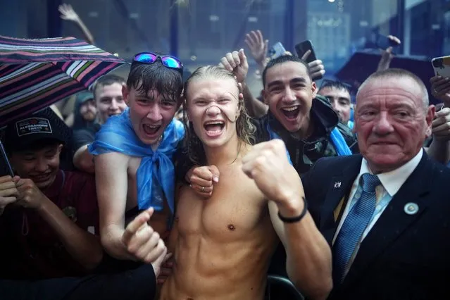 Erling Haaland celebrates as the pose for a photo with fans during the Manchester City trophy parade on June 12, 2023 in Manchester, England. (Photo by Tom Flathers/Manchester City FC via Getty Images)