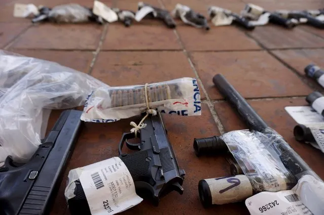 Seized weapons are seen before being destroyed by the authorities of the General Directive for the Control of Weapons and Munitions, (DIGECAM), in Guatemala City, December 17, 2015. (Photo by Jorge Dan Lopez/Reuters)