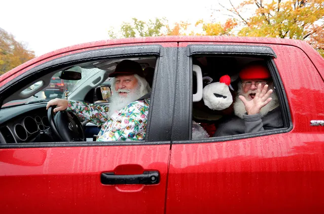 Santas wave as they leave for lunch between classes at the Charles W. Howard Santa Claus School in Midland, Michigan, U.S. October 27, 2016. (Photo by Christinne Muschi/Reuters)