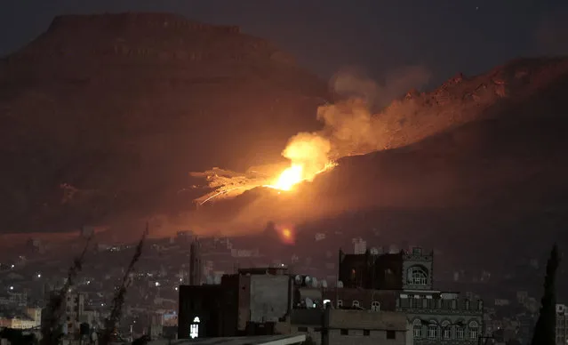 This October 14, 2016, file photo shows fire and smoke rise after a Saudi-led airstrike hit a site believed to be one of the largest weapons depots on the outskirts of Yemen's capital, Sanaa. The warring parties in Yemen have agreed to a 72-hour cease-fire which is to take effect shortly before midnight Wednesday, the U.N. special envoy to Yemen announced Monday, Oct. 17, 2016. A U.N. statement said Special Envoy Ismail Ould Cheikh Ahmed welcomes the restoration of the Cessation of Hostilities, which will spare the Yemeni people further bloodshed and will allow for the expanded delivery of humanitarian assistance. (Photo by Hani Mohammed/AP Photo)