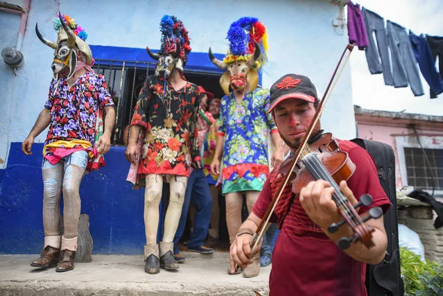 Inhabitants of the Afro-descendant town of Alto Tio Diego, celebrate the traditional carnival, where a group of masked men dance through the streets to celebrate in Veracruz, México on April 6, 2021. This year the carnival was reduced in days to avoid the spread of COVID-19, although this town is one of the few that does not have contagions and that is why they celebrated. (Photo by Hector Adolfo Quintanar Perez/ZUMA Wire/Rex Features/Shutterstock)