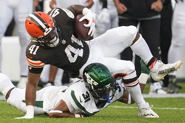 Cleveland Browns running back John Kelly Jr. (41) is tackled by New York Jets cornerback Craig James (31) during the first half of the NFL exhibition Hall of Fame football game, Thursday, August 3, 2023, in Canton, Ohio. (Photo by Sue Ogrocki/AP Photo)
