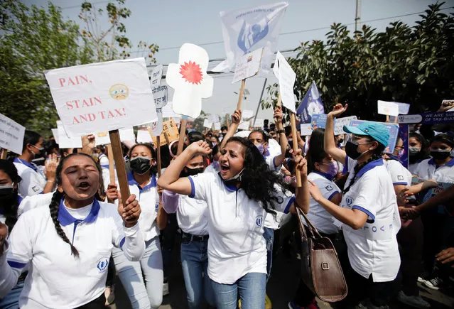 Women take part in a rally demanding tax free pads during the International Women's Day in Kathmandu, Nepal on March 8, 2021. (Photo by Navesh Chitrakar/Reuters)