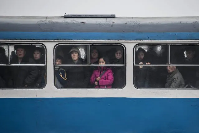 Commuters ride a tram in Pyongyang on November 27, 2016. (Photo by Ed Jones/AFP Photo)