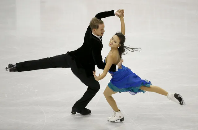 Pairs skaters Madison Chock, right, and Evan Bates perform in the short dance program of the U.S. Figure Skating Championships in St. Paul, Minn., Friday, January 22, 2016. They placed first in the event. (Photo by Ann Heisenfelt/AP Photo)