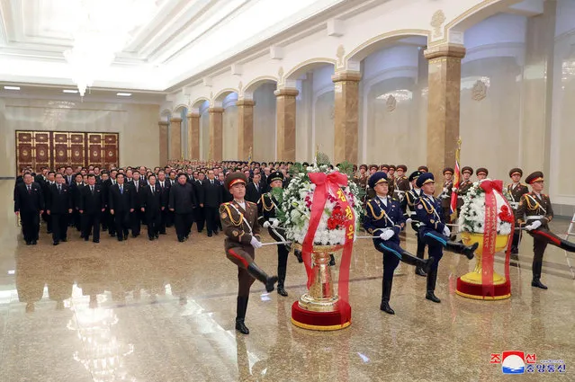 In this photo provided by the North Korean government, North Korean leader Kim Jong Un, sixth from left, visits the Kumsusan Palace of the Sun, where the body of late leader Kim Jong Il is laid, in Pyongyang, North Korea, Monday, December 17, 2018. North Koreans are marking the seventh anniversary of the death of leader Kim Jong Il with visits to statues and vows of loyalty to his son and successor, Kim Jong Un. Independent journalists were not given access to cover the event depicted in this image distributed by the North Korean government. The content of this image is as provided and cannot be independently verified. Korean language watermark on image as provided by source reads: “KCNA” which is the abbreviation for Korean Central News Agency. (Photo by Korean Central News Agency/Korea News Service via AP Photo)