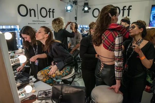 Models are put into their outfits and have their makeup done backstage at the punk themed “On|Off Presents Punk Diversity” fashion show during London Fashion Week on February 19, 2016 in London, England. (Photo by Chris Ratcliffe/Getty Images)