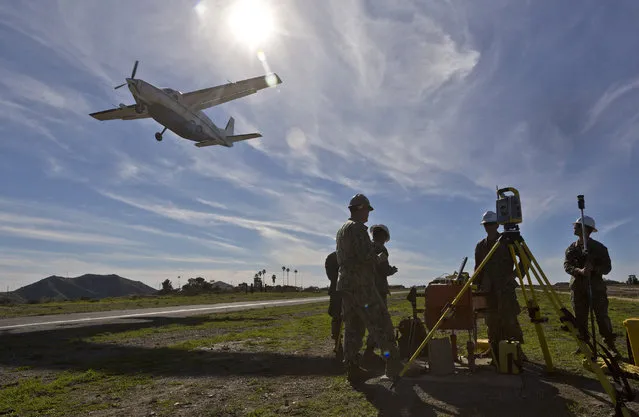 U.S. Marines surveyors help rebuild the mountaintop runway with a concrete airstrip on storied Santa Catalina Island, Calif., Friday, January 25, 2019. About 100 Marines and sailors began working on the island this month under an agreement with the I Marine Expeditionary Force at Camp Pendleton, California, and the Catalina Island Conservancy. The airport dates to 1941, when it was built by leveling two mountaintops and filling in the remaining canyon to create the 3,000-foot (914-meter) main runway, which sits at an elevation of about 1,600 feet (488 meters) about 10 miles from the city of Avalon. (Photo by Damian Dovarganes/AP Photo)