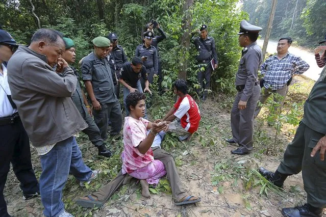 A Cambodian fisherman, who is a suspect, (C), points during a crime re-enactment at Koh Kood island near Thailand's maritime border with Cambodia, February 29, 2016. Five Cambodian fishermen have confessed to raping and assaulting French tourists on an isolated Thai beach, Cambodia's foreign ministry said in a statement on Tuesday. (Photo by Reuters/Dailynews)