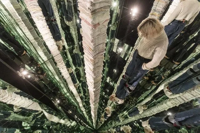 Lola Aylmer, 25, stands inside the artist Gemma Anderson-Tempini's infinite laundry mirrored room, which is part of a transformed Victorian house, in Leeds, UK early November 2023. (Photo by South West News Service)