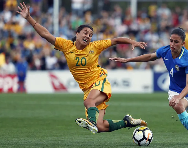 In this September 16, 2017, file photo, Australia's Sam Kerr, left, fights for the ball against Brazil's Rafaelle Carvalho Souzav during their friendly soccer match in Penrith, Australia. Kerr has been named captain of the women's national soccer, Wednesday, Feb. 27, 2019, as they prepared for Thursday's first match against New Zealand in the four-team Cup of Nations tournament. (Photo by Daniel Munoz/AP Photo)