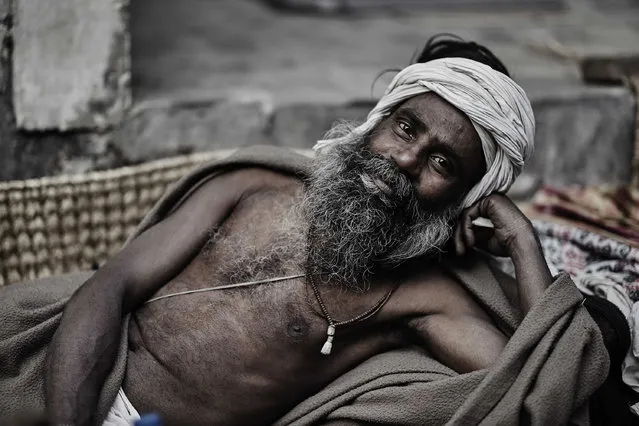 A holy man leans on his arm, taken in Kathmandu, Nepal. (Photo by Jan Moeller Hansen/Barcroft Images)