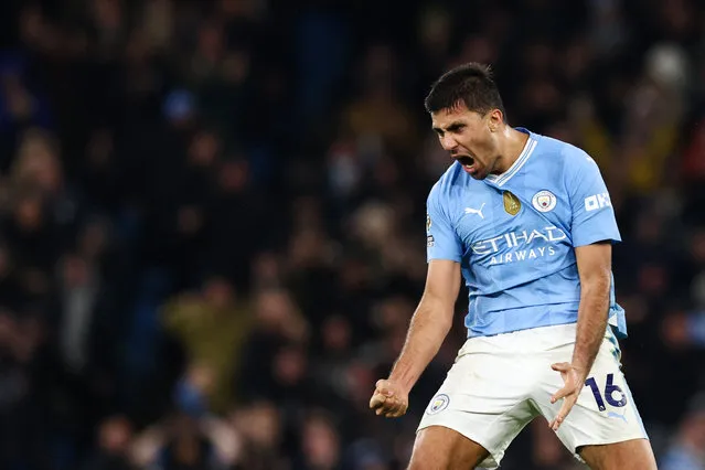 Manchester City's Spanish midfielder #16 Rodri celebrates after scoring his team first goal during the English Premier League football match between Manchester City and Chelsea at the Etihad Stadium in Manchester, north west England, on February 17, 2024. (Photo by Darren Staples/AFP Photo)