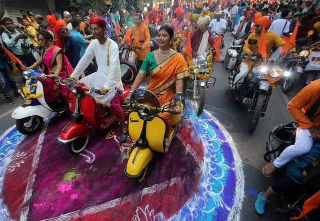 People dressed in traditional costumes ride scooters and motorbikes as they attend celebrations to mark the Gudi Padwa festival, the beginning of the New Year for Maharashtrians, in Mumbai, April 6, 2019. (Photo by Francis Mascarenhas/Reuters)