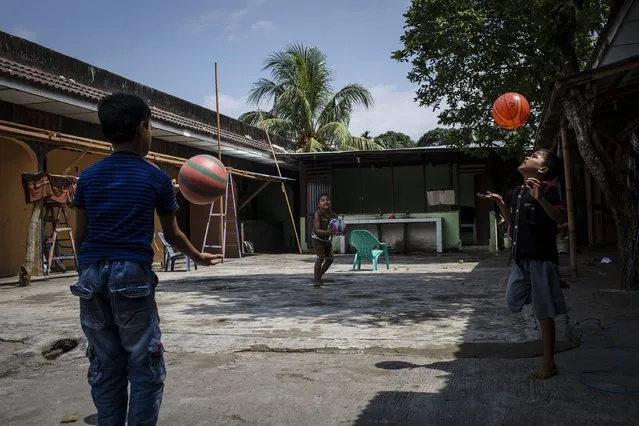 A Rohingya refugee children playing ball outside of their refugee camp on February 12, 2017 in Medan, North Sumatra, Indonesia. (Photo by Ulet Ifansasti/Getty Images)