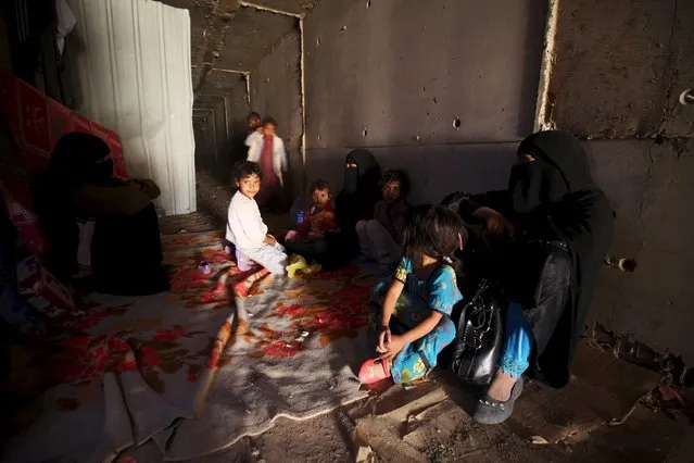 Displaced people rest in an underground water tunnel after they were forced to flee their homes due to ongoing air-strikes carried out by the Saudi-led coalition in Sanaa May 2, 2015. (Photo by Mohamed al-Sayaghi/Reuters)