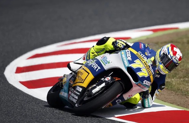 Switzerland's Dominique Aegerter steers his Kalex during the Moto 2 third free practice session for the motorcycle GP in Montmelo, Spain, Saturday, June 13, 2015. The Catalunya Grand Prix will take place on Sunday in Montmelo. (AP Photo/Manu Fernandez)