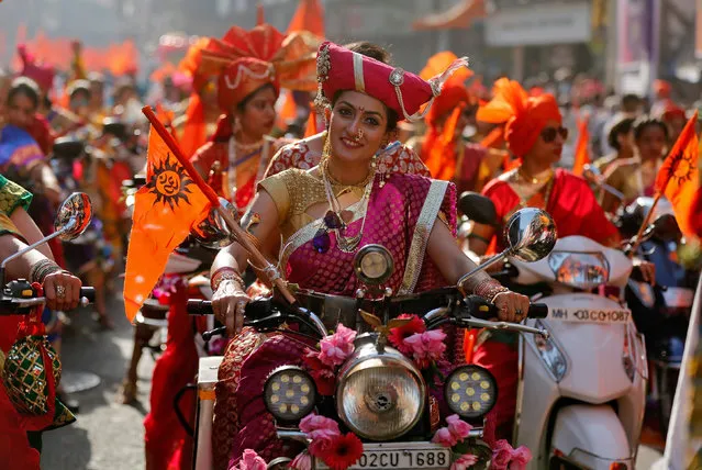 Women dressed in traditional costumes ride motorbikes as they attend celebrations to mark the Gudi Padwa festival, the beginning of the New Year for Maharashtrians, in Mumbai, India March 28, 2017. (Photo by Shailesh Andrade/Reuters)