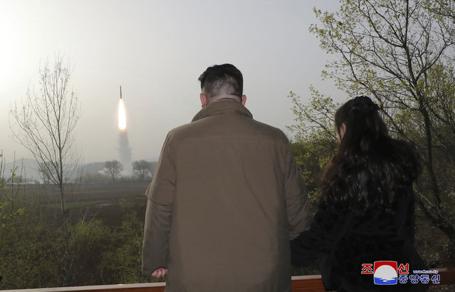 This photo provided April 14, 2023, by the North Korean government, shows North Korean leader Kim Jong Un, center, inspects what it says is the test-launch of Hwasong-18 intercontinental ballistic missile Thursday, April 13, 2023 at an undisclosed location, North Korea. Independent journalists were not given access to cover the event depicted in this image distributed by the North Korean government. The content of this image is as provided and cannot be independently verified. Korean language watermark on image as provided by source reads: “KCNA” which is the abbreviation for Korean Central News Agency. (Photo by Korean Central News Agency/Korea News Service via AP Photo)