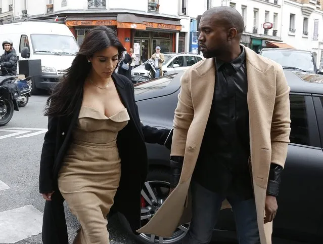 TV personality Kim Kardashian and rapper Kanye West arrive at a fashion designer workshop in Paris May 21, 2014. U.S. television personality Kim Kardashian and rapper Kanye West will celebrate their wedding in Florence on May 24, an official from the mayor's office confirmed on Friday. (Photo by Gonzalo Fuentes/Reuters)