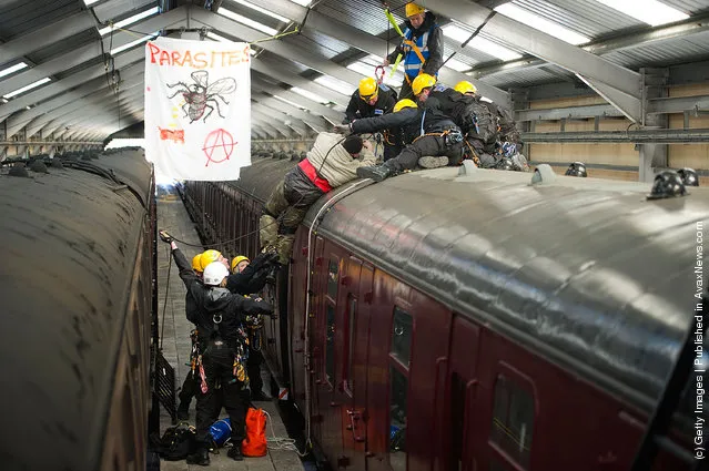 Police take part in a role play exercise as they clear a protest on top of a train during training in Oxenhope, England