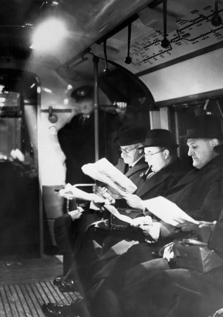 New lights installed in London Subways. London, England, 1940. Travelers reading by the light of new lamps installed in the London subways. The lights have been approved by the various defense bureaus and will provide full peace-time light while the trains are in tunnels. During air raid alarms they will be turned out and subdued lights used. (Photo by Bettmann/Getty Images)