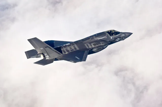 A Lockheed Martin F-35B Lightning II joint strike fighter flies toward its new home at Eglin Air Force Base, Florida in this U.S. Air Force picture taken on January 11, 2011. (Photo by Staff Sgt. Joely Santiag/Reuters/U.S. Air Force)