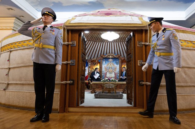 The president of Mongolia, Ukhnaa Khürelsükh, speaks with the French president, Emmanuel Macron, inside a traditional yurt during a meeting at the government palace in Ulaanbaatar, Mongolia on May 21, 2023. (Photo by Jacques Witt/SIPA Press/Rex Features/Shutterstock)